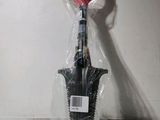 a pair of scissors in a plastic bag on a table
