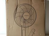 an image of a cardboard box with a fan on top of it