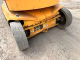 a large yellow machine that is sitting on the ground