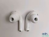 a pair of earphones sitting on top of a white surface