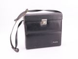 a black briefcase that is sitting on a white surface