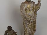 statue of a man and a child standing next to each other