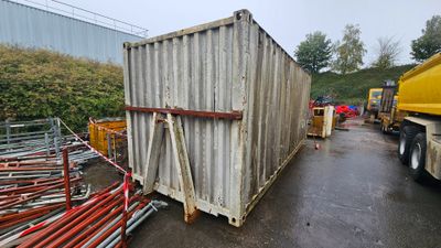 a large container sitting on the side of the road