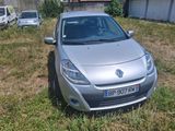 a silver car that is parked in the grass