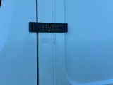 a sign on the side of a white van