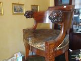 a chair that is sitting in the middle of a room