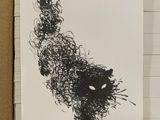 a drawing of a cat on a piece of paper in a box