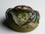 a crab that is sitting on top of a bowl