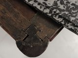 a close up of a piece of wood with a padlock on it