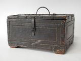 an old trunk that is sitting on a white surface