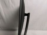 an image of a black television on a stand against a white backdrop