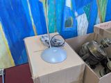 a table with a lamp on top of it next to a box of silverware