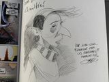 someone is drawing a picture of a woman in a book