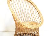 a wicker chair that is sitting on the floor