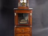an antique wooden cabinet with a clock on top of it