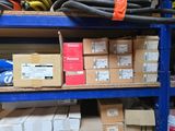 many boxes and hoses on the shelves in the warehouse