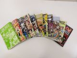 a lot of comic books on a white table