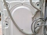 a washing machine that has a hose attached to it