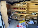 a van that has a bunch of items inside of it