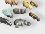 a lot of different animal figurines on a white surface