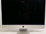 a computer monitor sitting on top of a white table
