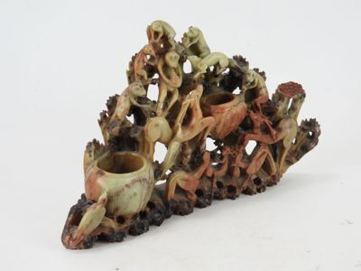 a sculpture of a group of people riding on a horse
