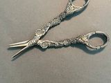 a pair of scissors that are sitting on a table