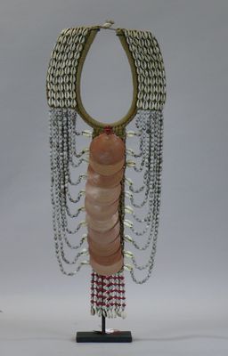 a sculpture of a woman with a chain around her neck