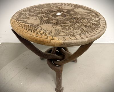 a wooden table with a decorative design on it