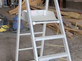 a ladder that is sitting in the middle of a building