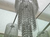 a chandelier hanging from the ceiling in a room