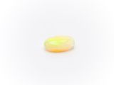 a yellow oplite gems on a white background