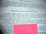 a pink post it on top of an open book