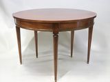 une image représentant une table en bois avec deux pieds et un plateau rond