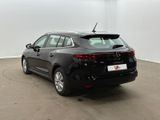 the rear of a black car parked in a garage