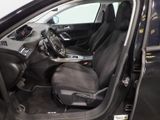 the interior of a car with the door open and the driver ' s seat up