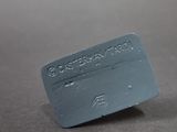 a close up of a plastic business card on a table