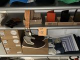 many hats and other items on a shelf in a store