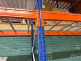 a blue and orange racking in a warehouse