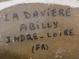 a close up of a vase with writing on it