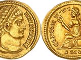a gold coin with an image of a woman on it