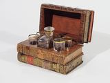 a box with a bottle and glasses on top of it