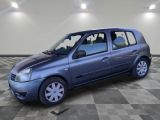 a picture of a small blue car parked in a garage