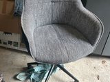 a chair that is sitting in the middle of a room