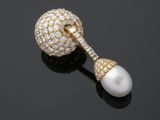 a pair of pearl and diamond earrings