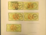un vieux livre sur lequel sont collés tout un tas de timbres différents