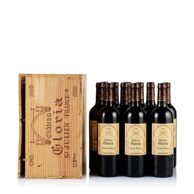 six bottles of red wine in a wooden box with a wooden box