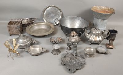 a lot of silver items that are on the table