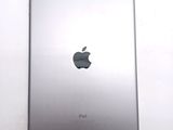 an apple ipad sitting on top of a white table next to a white wall