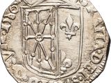a close up of a coin with a coat of arms on it
